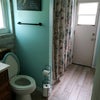 Photo 4: Your bathroom.  Door leads to pool area.