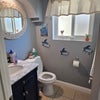 Photo 9: Shared 1/2 bathroom downstairs 