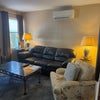 Photo 3: Living room with leather sofa and marble coffee table, wall air conditioner