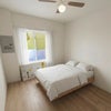 Photo 7: Cozy furnished bedroom with natural light and ceiling fan