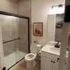 Photo 9: Downstairs bath with walk-in shower