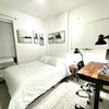 Photo 2: Room 1: queen size bed, sitting/standing desk
