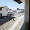 Photo 6: View from balcony.  Tennis court near by.