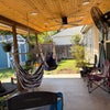 Photo 8: Batch porch has 2 hanging chairs, 2, hammoks, 2 ceiling fans, griddle, grill, pizza oven,and smoker
