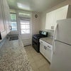 Photo 2: Kitchen with door to balcony 