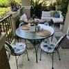 Photo 6: Outdoor dining and seating on the private patio with views of the fountain and pool!