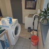 Photo 8: Washer <1 year-old, iron, iron-board, drying rack.  Laundry detergent and personal laundry cleaning 