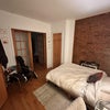 Photo 7: Your room with tons of closet space and exposed brick