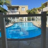 Photo 2: pool from our patio balcony
