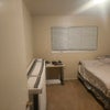 Photo 3: Large bed will be removed and new twin bed will be placed. Closet is located in front of bed.