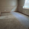 Photo 3: This is the 2nd living space, pocket door closes it off from upper levels