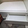 Photo 4: Queen bed with storage drawers and acoustic walls available to use in the downstairs room. 