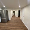 Photo 2: View from door looking into the kitchen and towards laundry room and bathroom