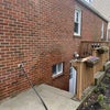 Photo 9: Outside entrance to basement apartment 
