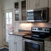 Photo 3: Renovated kitchen with washer/dryer and stainless applicances