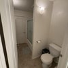 Photo 6: shared bathroom toilet / shower