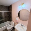 Photo 4: Guest bathroom with shower/tub combination and vanity