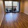 Photo 2: Living room with private balcony