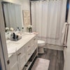 Photo 2: Two sinks with bathtub  