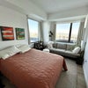 Photo 3: Primary bedroom as furnished by previous tenant (queen bed and large sofa fit easily)
