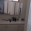Photo 2: Sink and medicine cabinet
