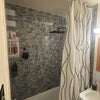 Photo 5: Waterfall showerhead and cieling high curtains