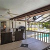 Photo 8: Covered Porch and Screened in Pool