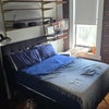 Photo 1: Tall vertical dresser, and space underneath the bed for storage / luggage 