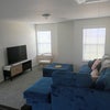 Photo 3: Common living room upstairs with TV and Sofa