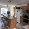 Photo 4: large kitchen with island and dishwasher