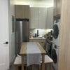 Photo 2: Main room kitchen and laundry