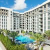 Photo 9: Exterior view of the building and pool