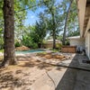 Photo 2: Back yard with pool