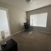 Photo 3: Furnished room comes with one desk and office chair, one nightstand and lamp, and one twin bed