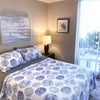 Photo 2: :arge bedroom facing patio
