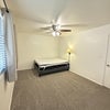 Photo 5: Queen sized bed pictured for room size reference