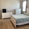 Photo 2: Queen bed, dresser, chest, and small fridge