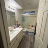 Photo 2: Bathroom still furnished with me and current roommates stuff