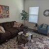 Photo 2: Living room has projector and flat screen TV