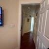 Photo 3: Hallway to bathroom on left (open door)