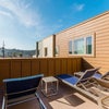 Photo 8: Open air common areas on each floor with outdoor furniture