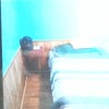 Photo 4: Left  side of the  room  showing the bed