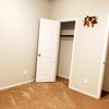 Photo 8: The downstairs bedroom features a huge double‑door closet and its own private bathroom just a few 