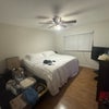 Photo 5: Room comes unfurnished - included for scale. Cal king bed
