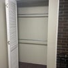 Photo 3: Large closet. More hanging space in the utility room next door.