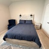 Photo 2: Cozy bed and reading chair
