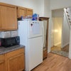 Photo 4: Refrigerator and Microwave