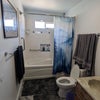 Photo 5: Shared bathroom access with homeowners, including tub/shower.