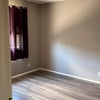 Photo 6: second bedroom, photographed from doorway to give a sense of size