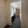 Photo 3: Front door+common area, kitchenette, laundry, bathroom.